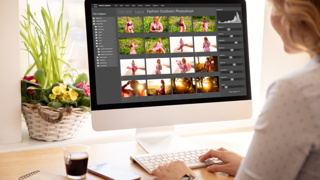 How to edit and prepare images for Shopify A woman editing images for Shopify on a large monitor.
